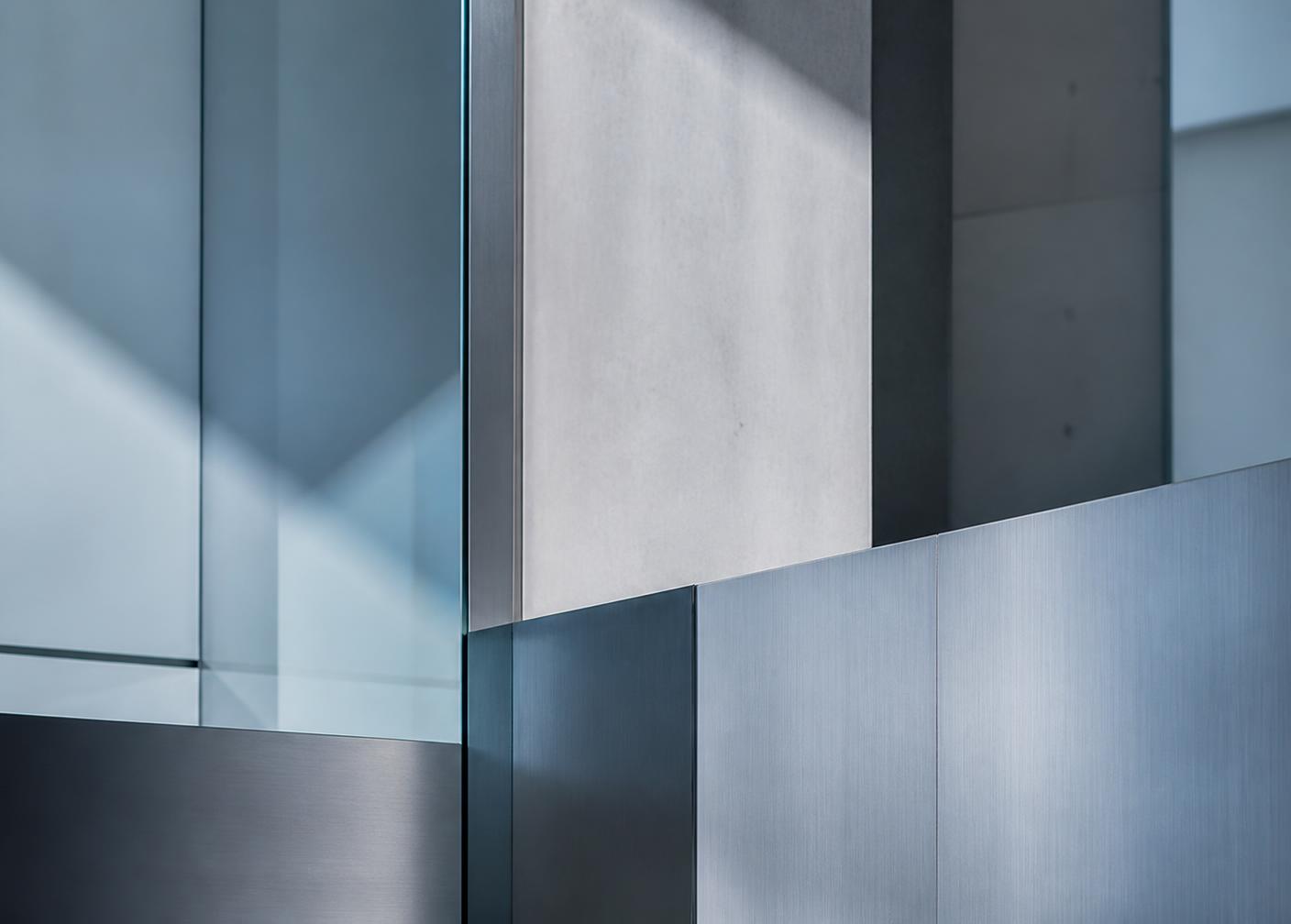 Abstract composition of layered structural panels in cool blue and grey tones